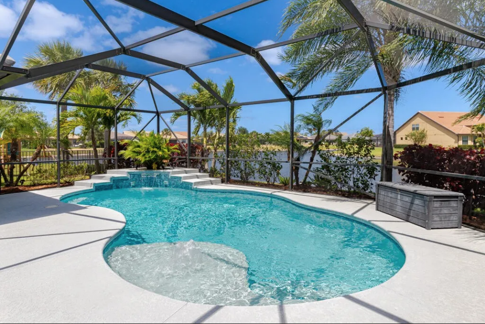 Heated saltwater pool and tropical backyard at 348 SE Courances Drive, Port St. Lucie FL
