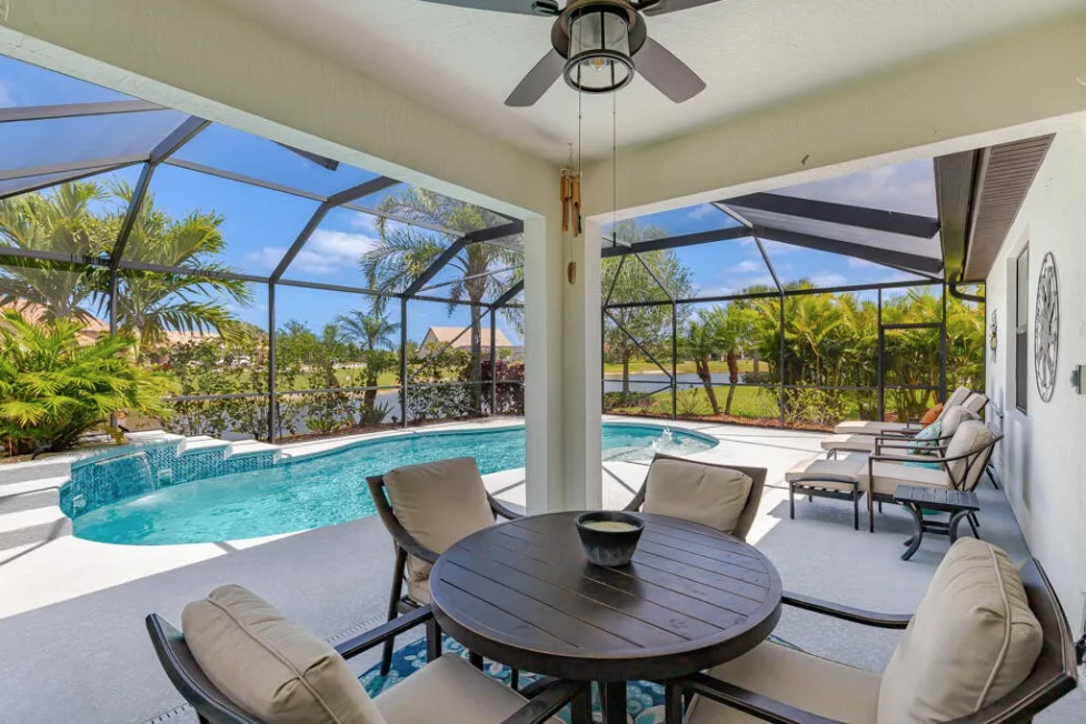Pool deck and outdoor living area at 348 SE Courances Drive, Port St. Lucie FL