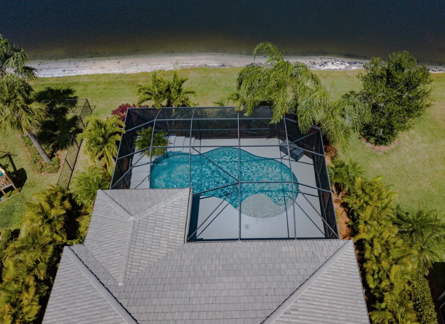 Saltwater pool with bubbler and covered patio — 348 SE Courances Drive FL