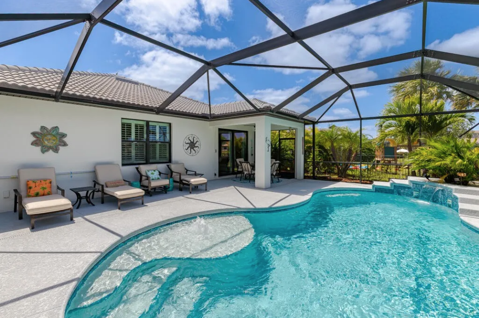 Outdoor covered patio and pool area — 348 SE Courances Drive, Port St. Lucie FL